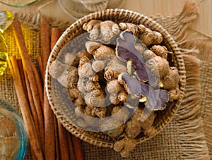 Black galingale on wooden table