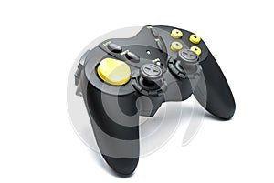 Black game controller with yellow buttons.