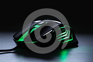 Black gaming mouse with green light