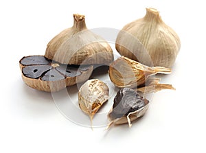 Black garlic bulbs and cloves