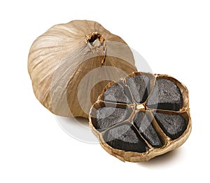 Black garlic bulbs isolated on white background