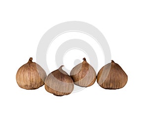 Black garlic bulbs isolated on white background