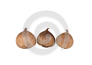 Black garlic bulbs isolated on white background