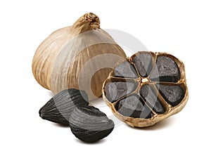 Black garlic cloves isolated on white background