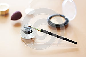 Black Gel eyeliner close up with a make up brush