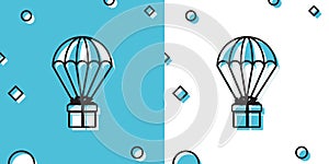 Black Gift box flying on parachute icon isolated on blue and white background. Delivery service, air shipping concept