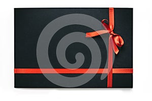 Black gift box with the red ribbon