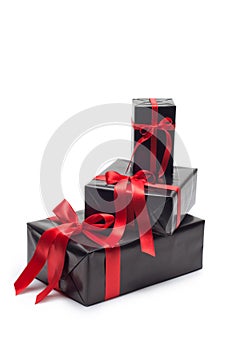 Black gift box with red satin ribbon and bow