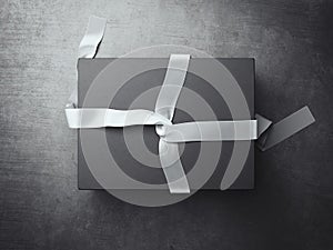 Black gift box with white decoration ribbon. 3d rendering