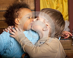 Black Girl kissing white boy.
