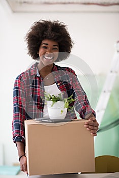 Black girl moving in the new apartment