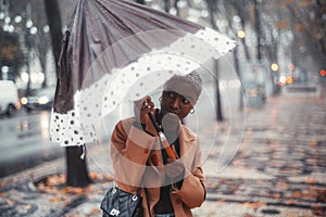 Black girl opening an umbrella