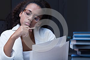 Black girl reading a document photo