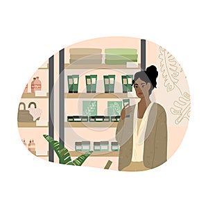 Black girl reading ingredients of organic bodycare product in cosmetics store