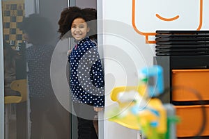 Black Girl at school entering class for lesson