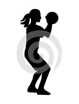 Black girl silhouette of a women\'s basketball player who stands and holds the ball with both hands
