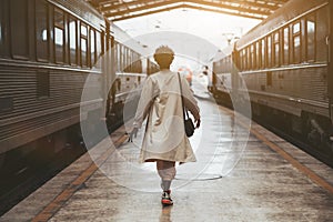 Black girl between two trains