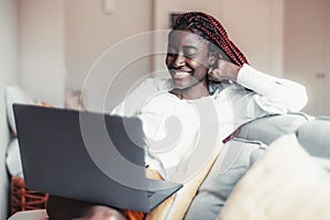 Black girl using laptop indoors