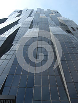 Black glass facade of modern DC Tower skyscraper in Vienna, Austria