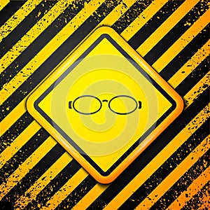 Black Glasses for swimming icon isolated on yellow background. Goggles sign. Diving underwater equipment. Warning sign