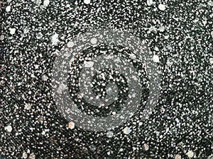 Black glitter sparkle background. Black friday shiny pattern with sequins. Christmas glamour luxury black christmas and glitter