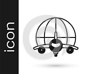 Black Globe with flying plane icon isolated on white background. Airplane fly around the planet earth. Aircraft world