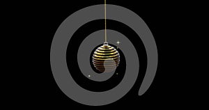 Black and gold christmas bauble swinging with gold sparkles on black background