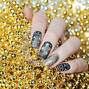 Black gold Christmas manicure with deer and snowflakes