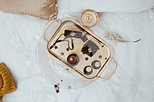 Black and Gold Female Accessories on Tray. Flat Lay, Top View