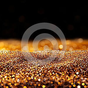 A black and gold glittery background with a black background