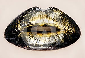 Black and gold lips close up