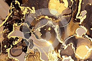 Black and gold marble abstract pattern. Alcohol ink technique