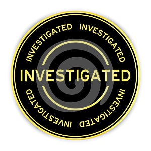 Black and gold round sticker with word investigated on white background