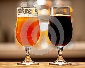 Black and golden beer in glasses homemade brewing
