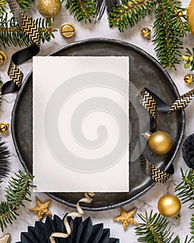 Black and golden Christmas Table setting with ornaments and fir tree branches. Menu card Mockup