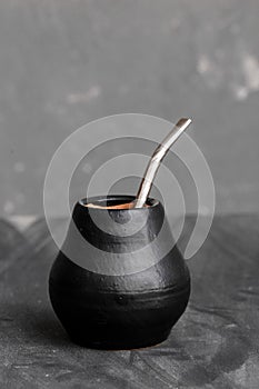 Black gourd with sipped metal straw best use for Yerba Mate tea