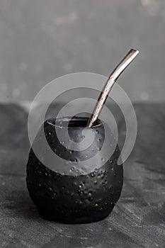 Black gourd with sipped metal straw best use for Yerba Mate tea