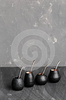 Black gourd with sipped metal straw best use for Yerba Mate tea