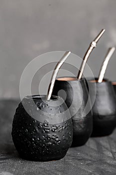 Black gourd with sipped metal straw best use for Yerba Mate tea