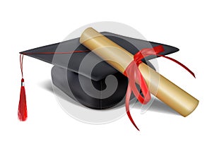 Black graduate hat and paper scroll tied with red ribbon with a bow
