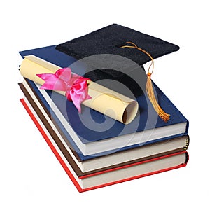 Black Graduation Cap with Degree on Books isolated