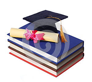 Black Graduation Cap with Degree on Books isolated