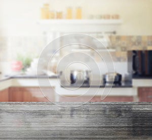 Black granite table top and blur of modern kitchen interior