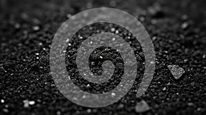 Black granular texture close up detail shot