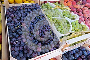 Black grape and green grape at the market