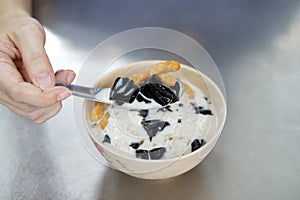 Black grass jelly with ginkgo nuts in iced fresh milk, Healthy and fusion dessert, popular street food