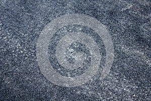 A black gray grainy asphalt texture. rough surface
