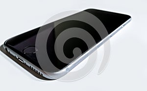 Black-gray mobile phone laying down