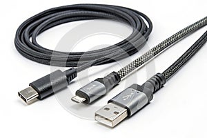 Black and gray USB cables isolated on white