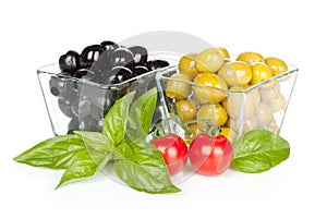 Black and green olives and tomatoes with basil